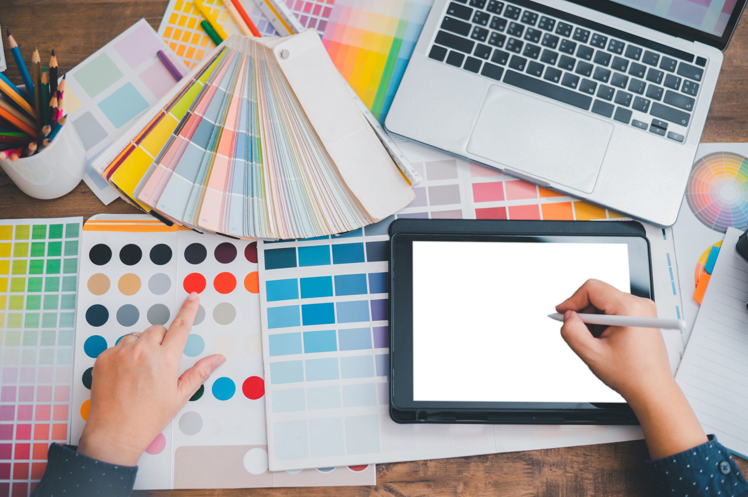 graphic designer architects who work with laptops and color comp